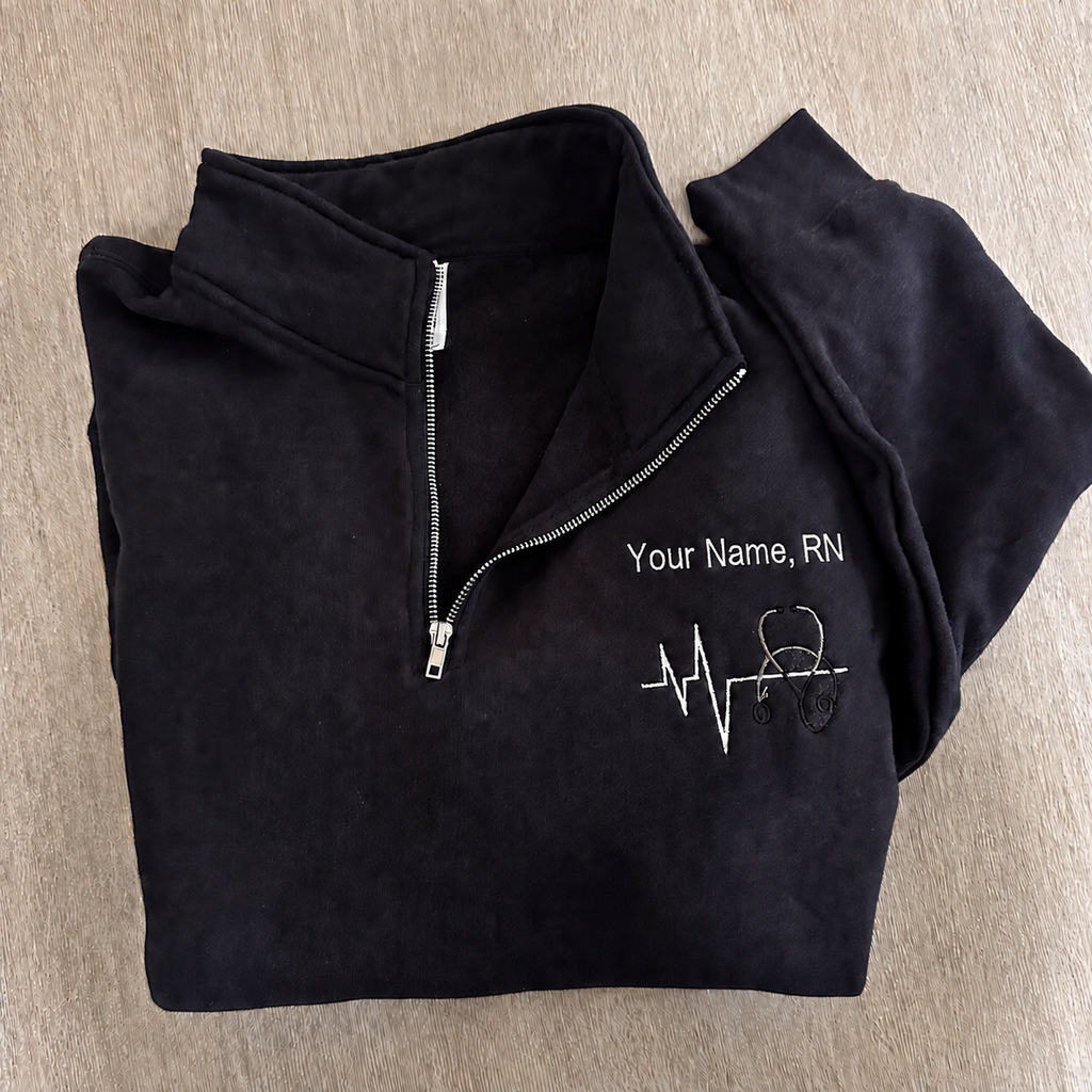 Custom nurse quarter-zip with embroidered name and credentials