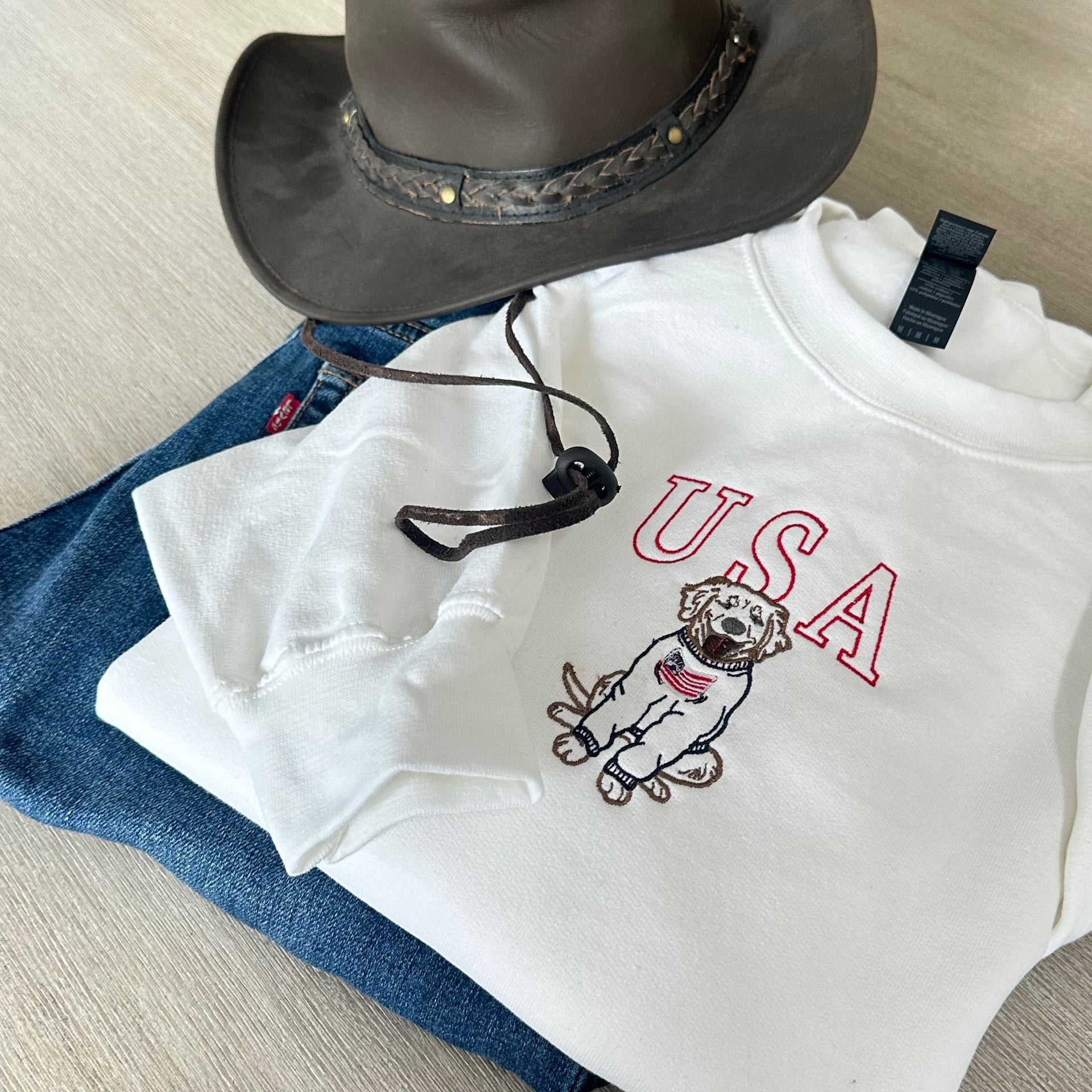 USA golden retriever embroidered sweatshirt with cowboy hat and jeans